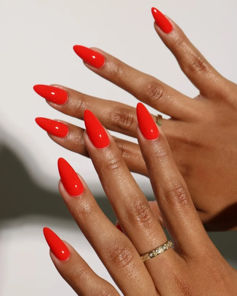 trending nail colors, long stiletto bright poppy red nails