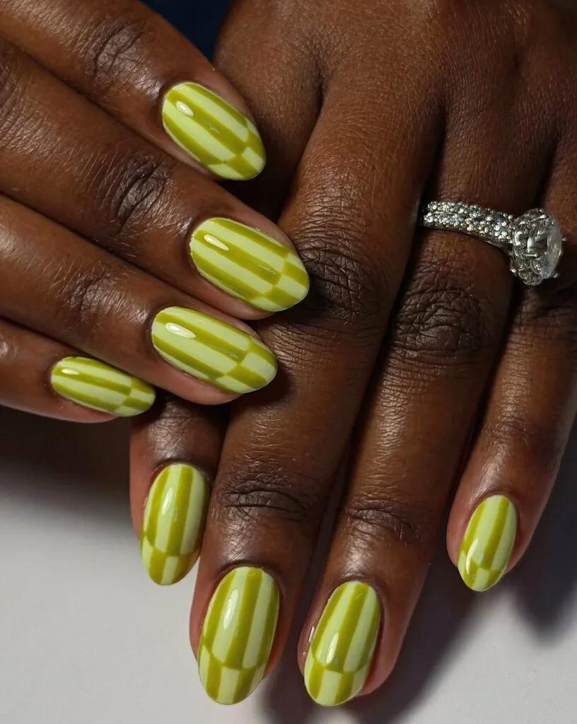 trending nail colors, round chartreuse nails with two tone stripe and checker art