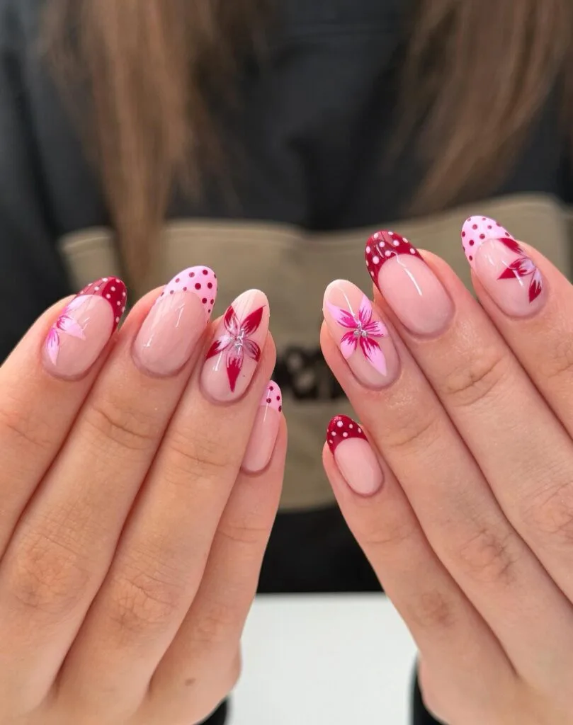 summer nail colors, almond French nails with red polka dot tips and pink hibiscus flower art