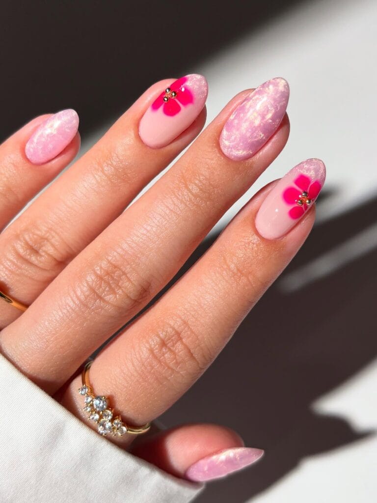 august nails, almond pink glitter marble nails with hot pink flower accents and gold bead centers