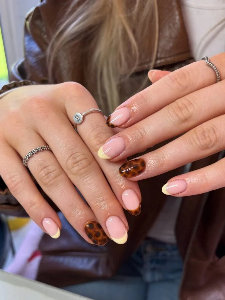 august nails, round tortoiseshell accent nails with pale yellow micro French tips
