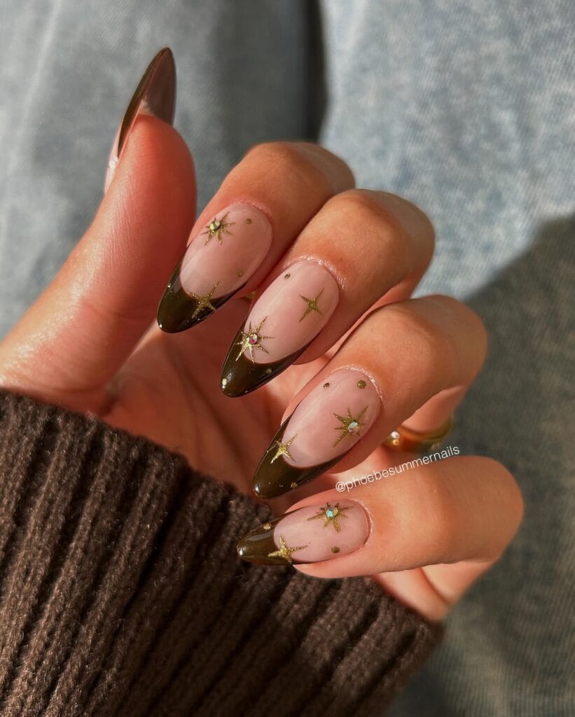 Sheer pink nails with espresso brown French tips and gold stars, fall nails,