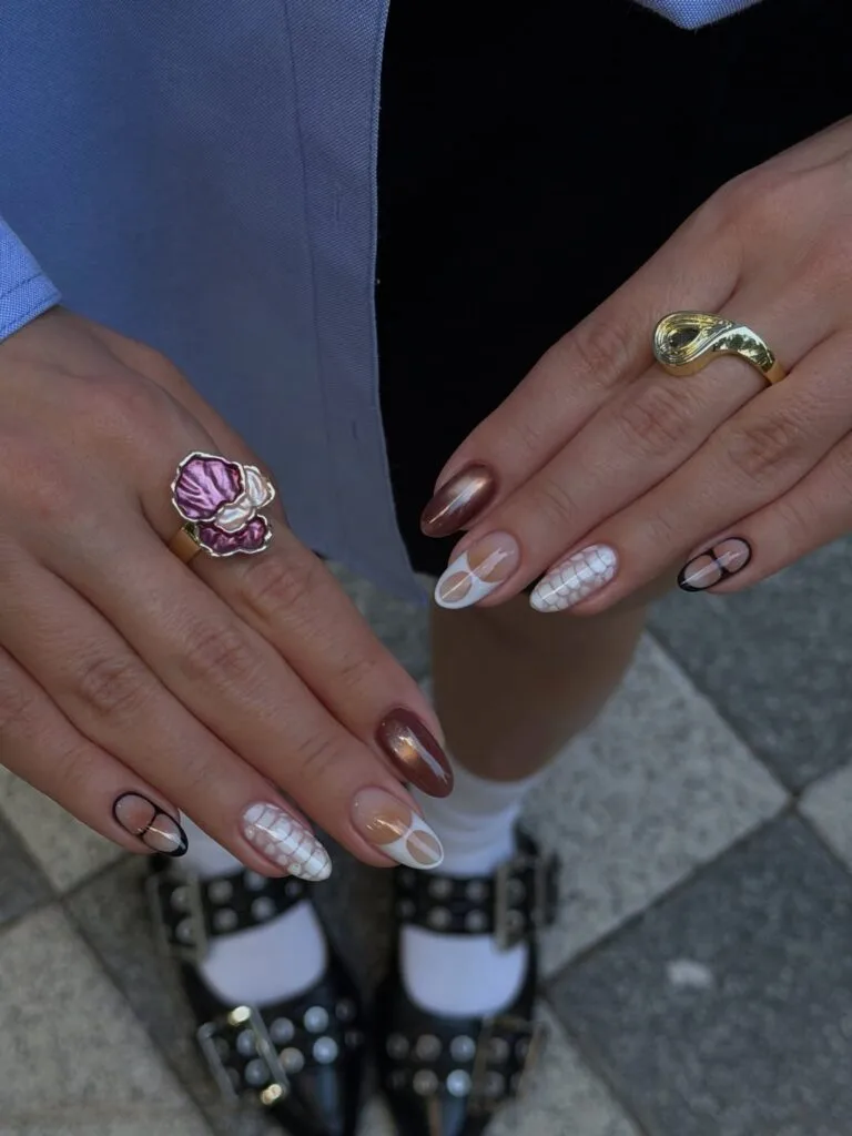 Mixed September nails with brown chrome, black line art, white loops, and grid accents.