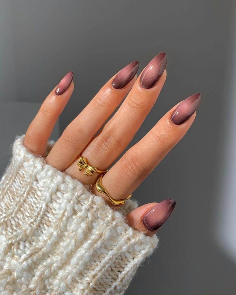 Smoky mauve autumn nails with dusty rose centers and deeper plum-brown aura edges.
