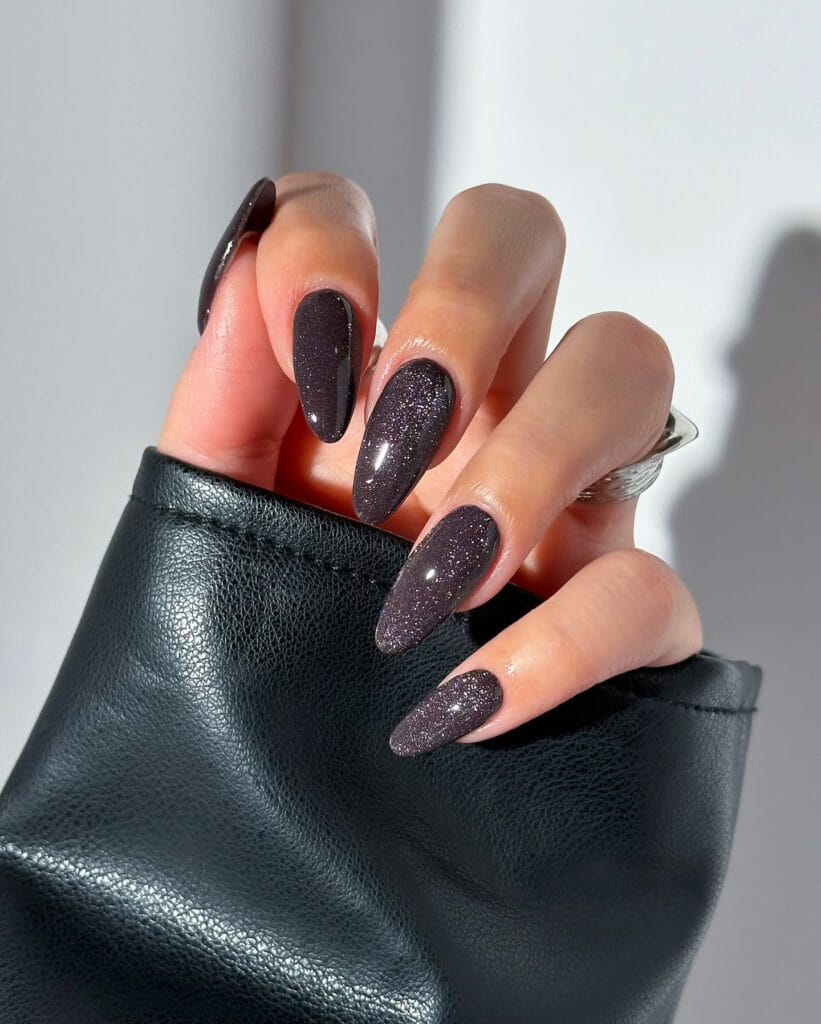 Long almond fall 2026 nails in dark plum velvet chrome with fine silver magnetic sparkle