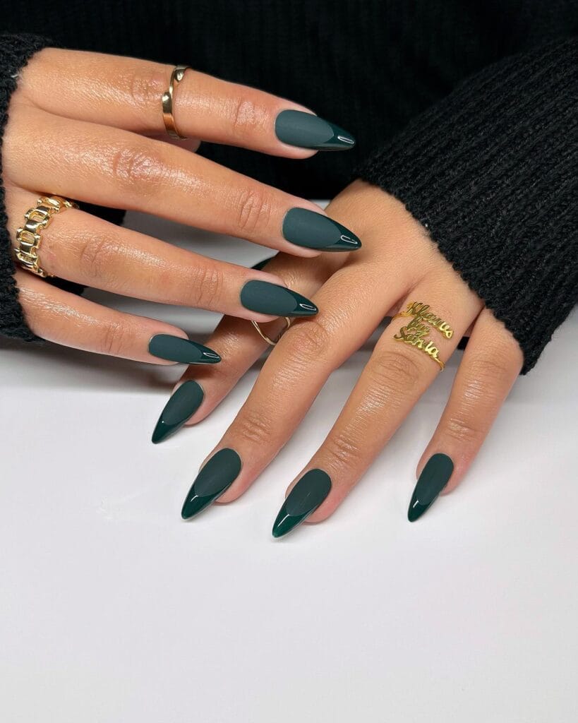 Long almond forest green nails with matte bases and glossy dark green French tips, fall nail colors.