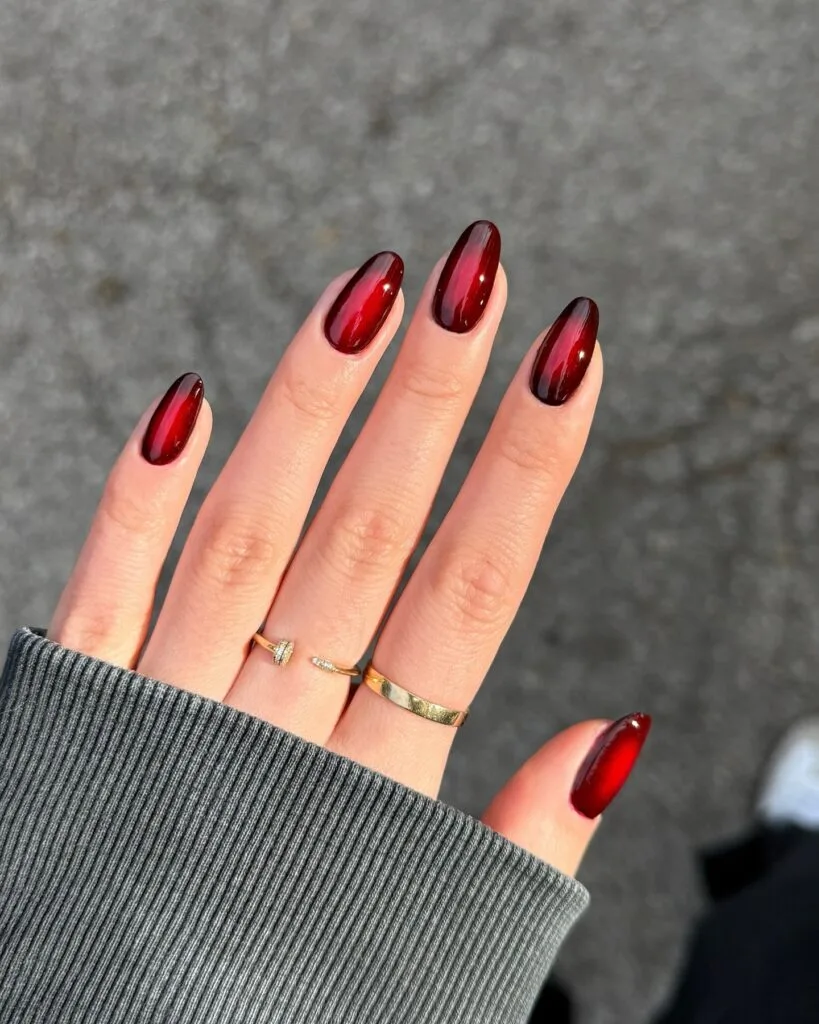 Glossy ruby red autumn 2026 nails with bright jelly centers and deep wine aura edges.