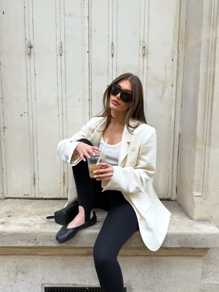Early fall outfit with white blazer, white tank, black leggings, black ballet flats, and sunglasses.