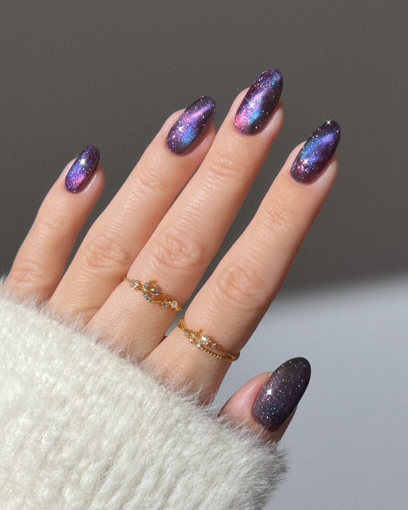 Dark smoky amethyst almond nails with blue and violet shimmer, fall nail colors.