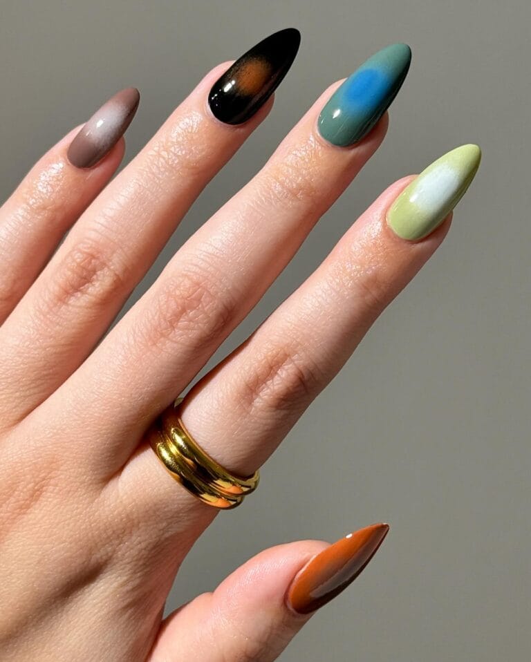Long almond fall nail trends 2026 with a different aura on each finger in taupe, teal, olive and rust
