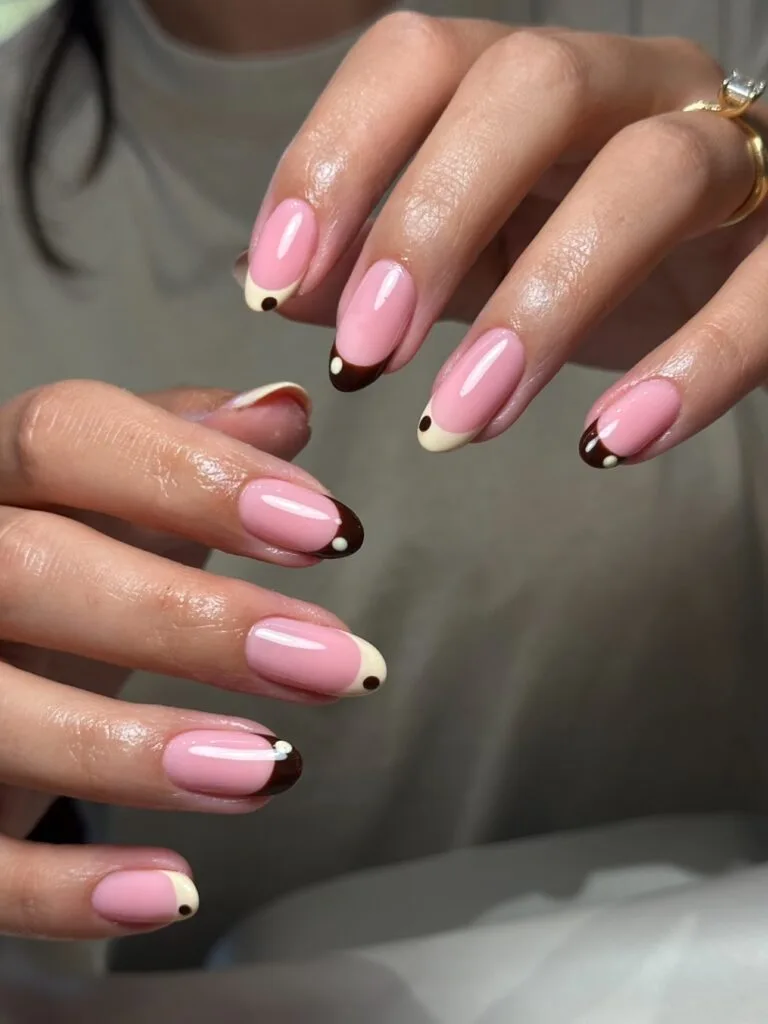 Short September nails with chocolate and cream French tips and tiny contrasting dots.