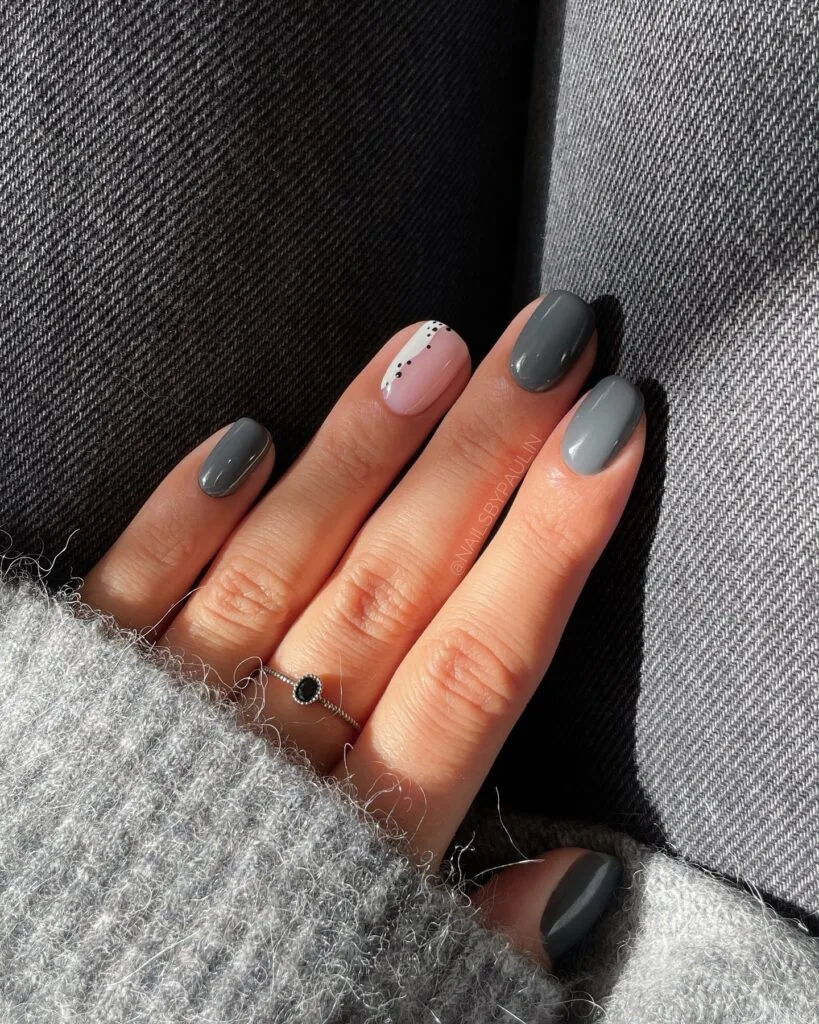 Mixed glossy oyster gray nails with one pale pink accent, fall nails