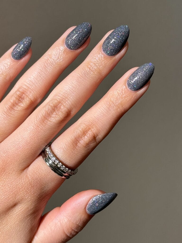 Graphite oyster gray almond nails with fine multicolor shimmer, an autumn nails look.