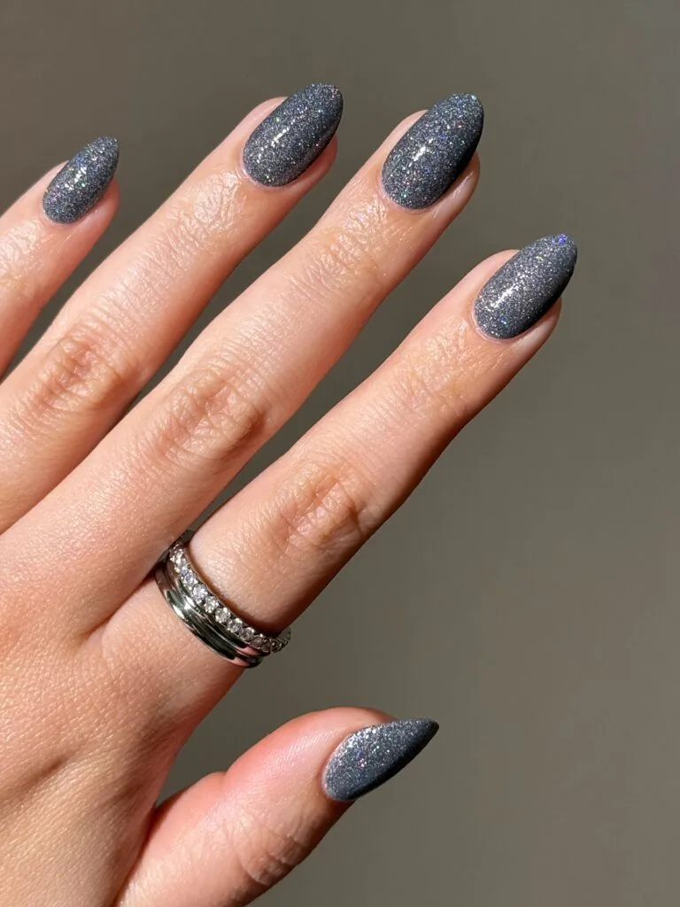 Graphite oyster gray almond nails with fine multicolor shimmer, an autumn nails look.