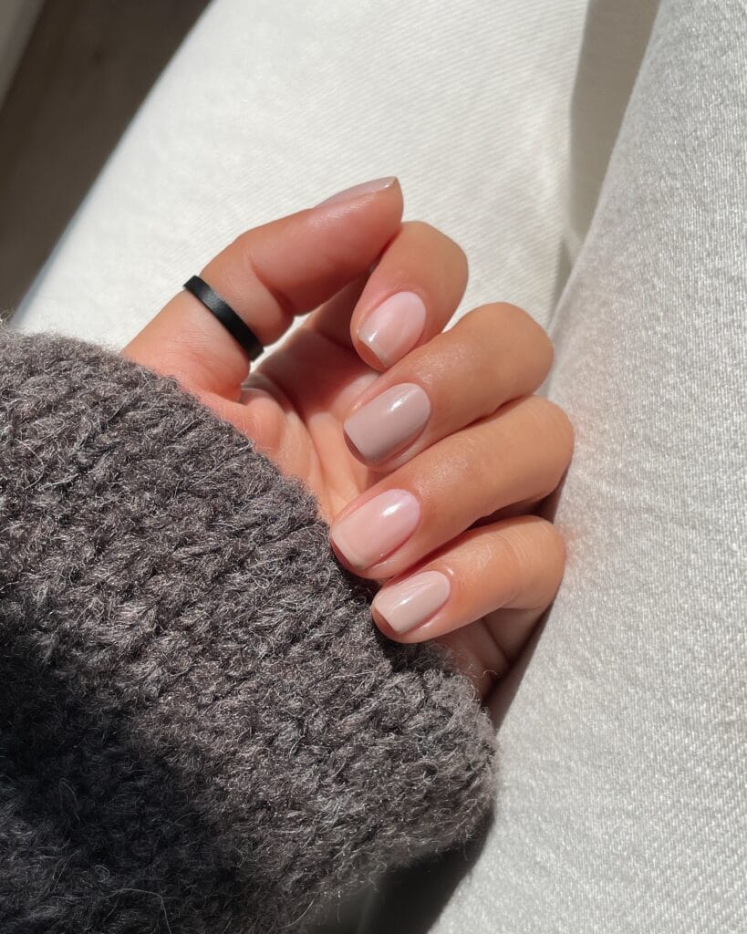 Short neutral fall nails in glossy blush, cool taupe, and milky beige shades.
