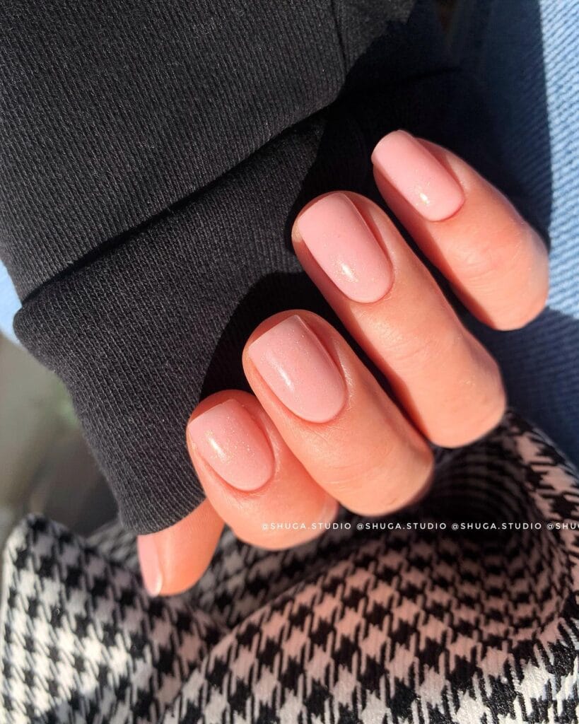 Short soft pink nude nails with subtle shimmer 