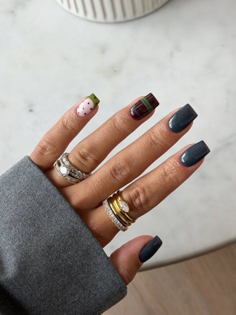 Short fall nail designs with smoky gray polish, burgundy plaid, olive accents, and square tips.
