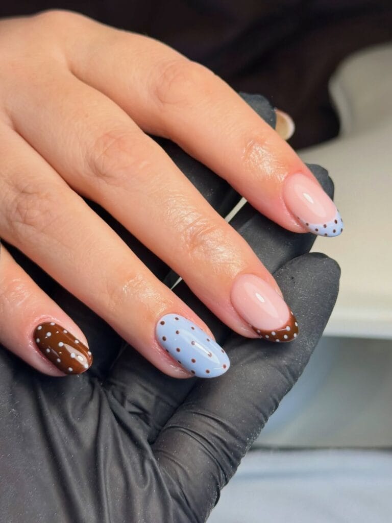 Autumn nails with blue dots on brown, brown dots on blue, and matching dotted French tips over pink bases.
