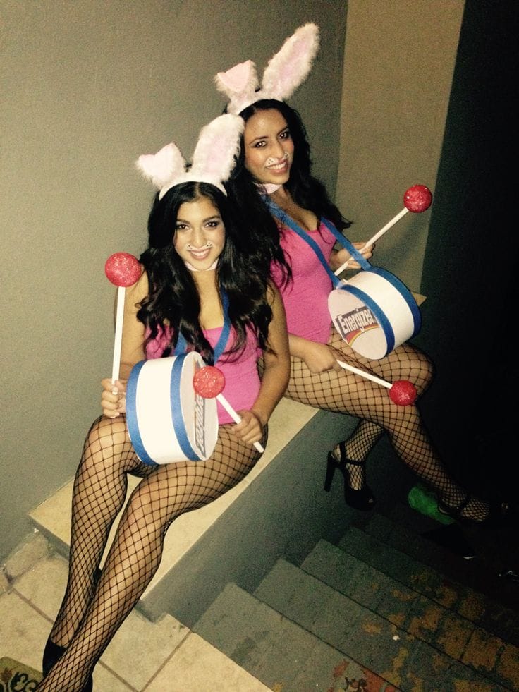 Best friend bunny costumes with pink bodysuits, ears, fishnets, and matching drums labeled “Energizer”.