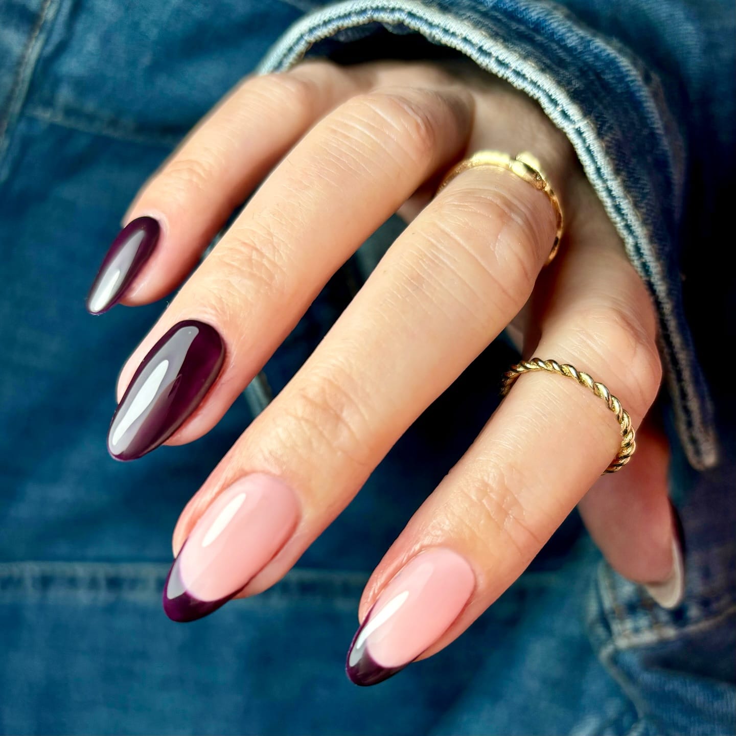 Almond fall nails mixing glossy deep plum with plum French tips on a sheer pink base